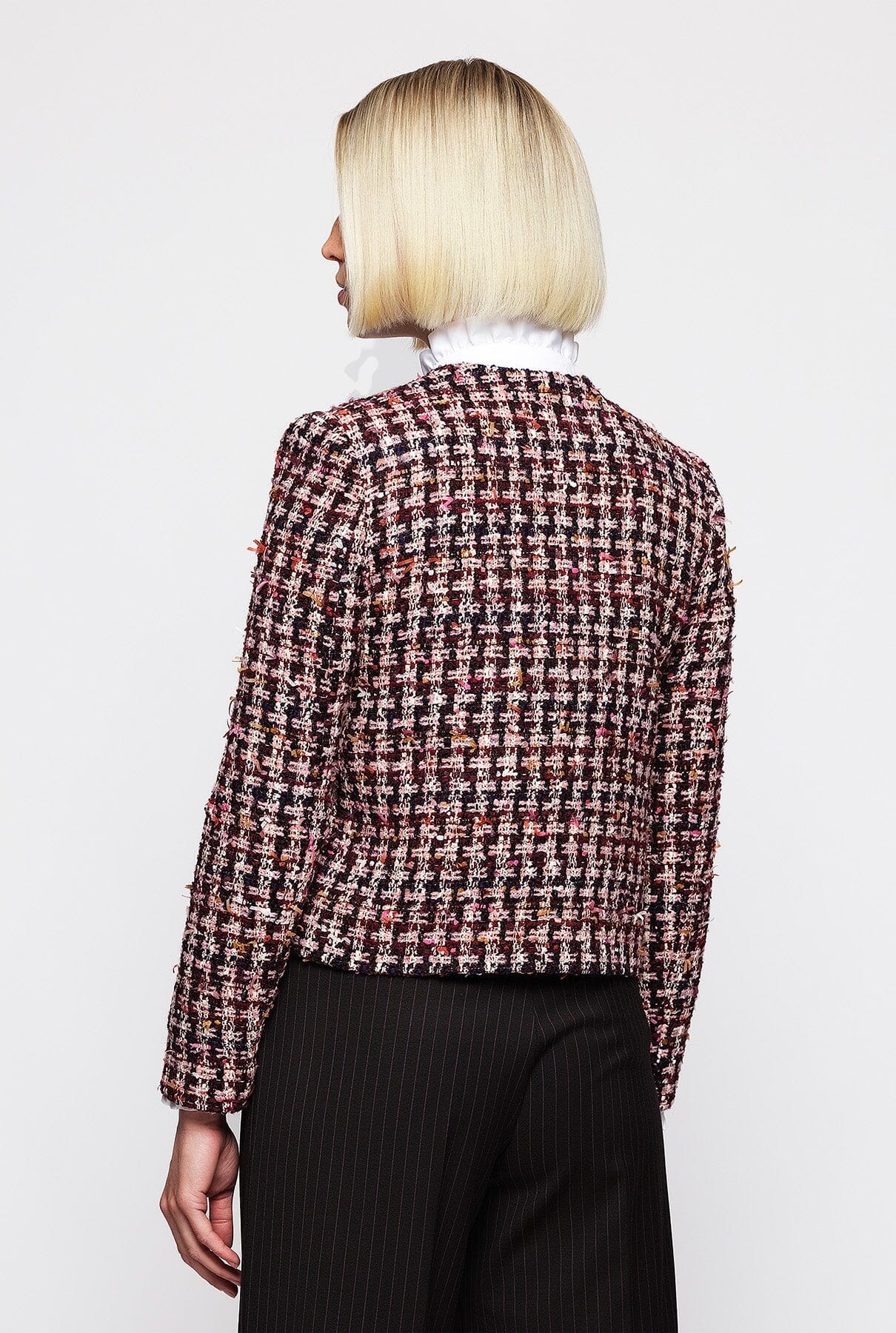 Tweed an artisanal fabric fully appreciated in this jacket as its beauty resides in the threads the weave the design the style. Pair with MIRTO fashion. Short tweed jacket with cross