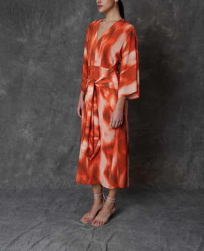 Vestido midi estampado en tonos coral con lazada frontal Dresses Roberto Torretta 